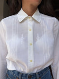 Camicia bianca ricamini