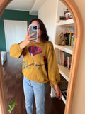 Maglione senape con fiore