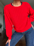 Maglione rosso trecce