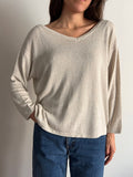 Maglione beige con bottoni dietro