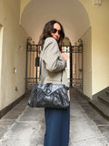Borsa nera con dettagli stampa cocco