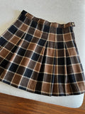 Mini gonna a pieghe marrone a quadri