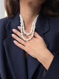 Collana intrecciata perline bianche