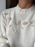 Maglione bianco con ricamo fiori