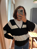 Pullover a righe bianche