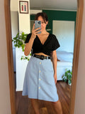 Gonna azzurra con bottoni
