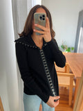 Cardigan nero con ganci