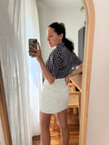 Mini gonna bianca con bottoni