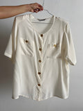 Camicia bianca con bottoni oro