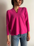 Maglione fuxia taglio vivo