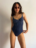 Costume intero blu con cuciture bianche
