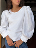 Blusa bianca con maniche a sbuffo 1