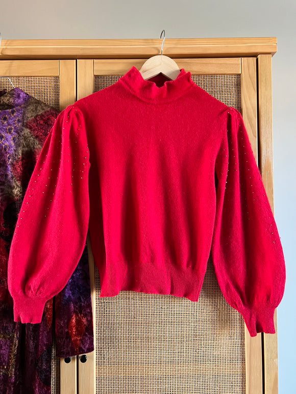Maglione rosso con perline