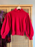 Maglione rosso con perline