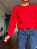 Maglione rosso trecce