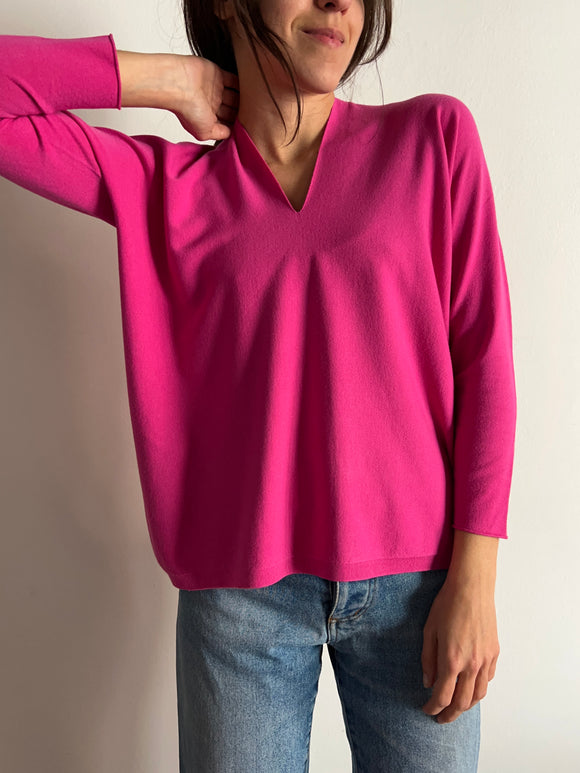 Maglione fuxia taglio vivo