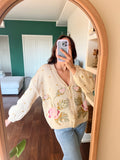 Cardigan crema con fiori