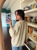 Cardigan crema con fiori