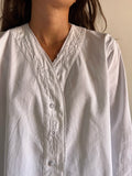 Camicia bianca larga corta