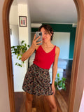 Gonna a portafoglio nera fiori
