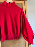 Maglione rosso con perline