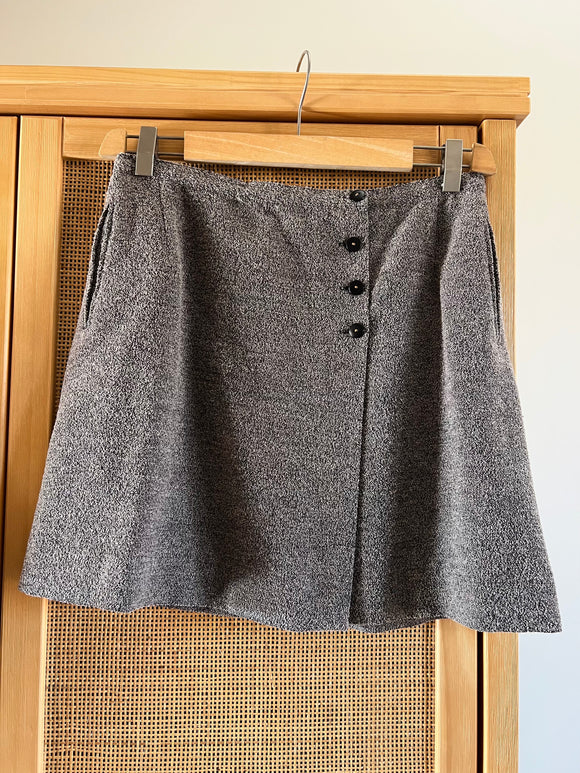 Gonna corta a portafoglio con bottoncini