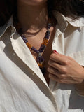 Collana con perle viola e arancioni