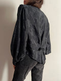 Camicia nera foglie