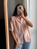 Camicia rosa di seta con fiocchetti