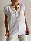 Blusa bianca profili gialli