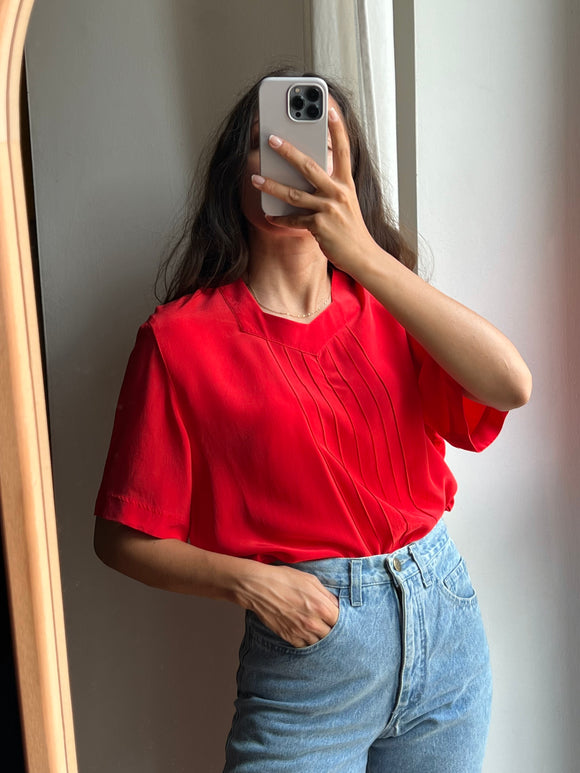 Blusa rossa di seta