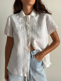 Camicia bianca di lino ricamata