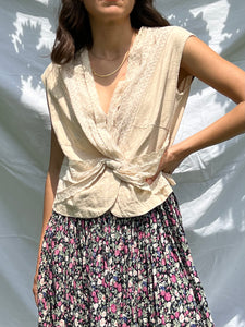 Top beige con incrocio
