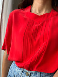 Blusa rossa di seta
