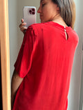 Blusa rossa di seta