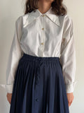 Camicia bianca con colletto lungo