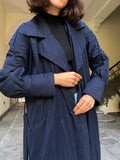 Trench blu con cintura