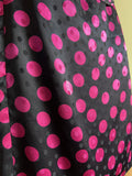 Abito di seta a pois fuxia