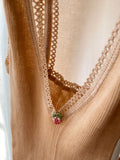 Top beige a costine con ricamino uva
