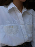 Camicia bianca con taschine tonde