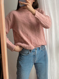 Maglione rosa intrecciato