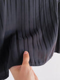 Pantaloni di cupro nero a righe