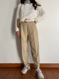 Pantaloni beige taglio maschile