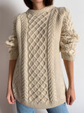 Maglione in lana grossa intrecciata fatto a mano
