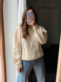 Maglione di lanona panna intrecciato fatto a mano