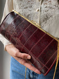Borsetta bordeaux con catenina