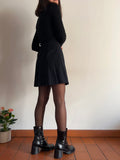 Gonna mini nera a pieghe