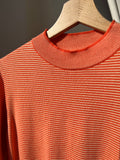 Maglione a righe arancione