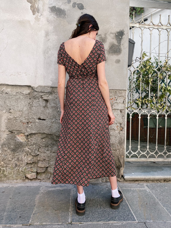 Abito roselline con scollo dietro