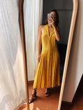 Abito giallo con schiena nuda